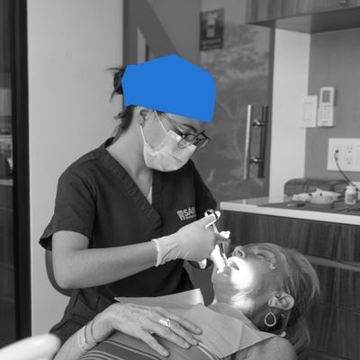 Dentist placing Crown